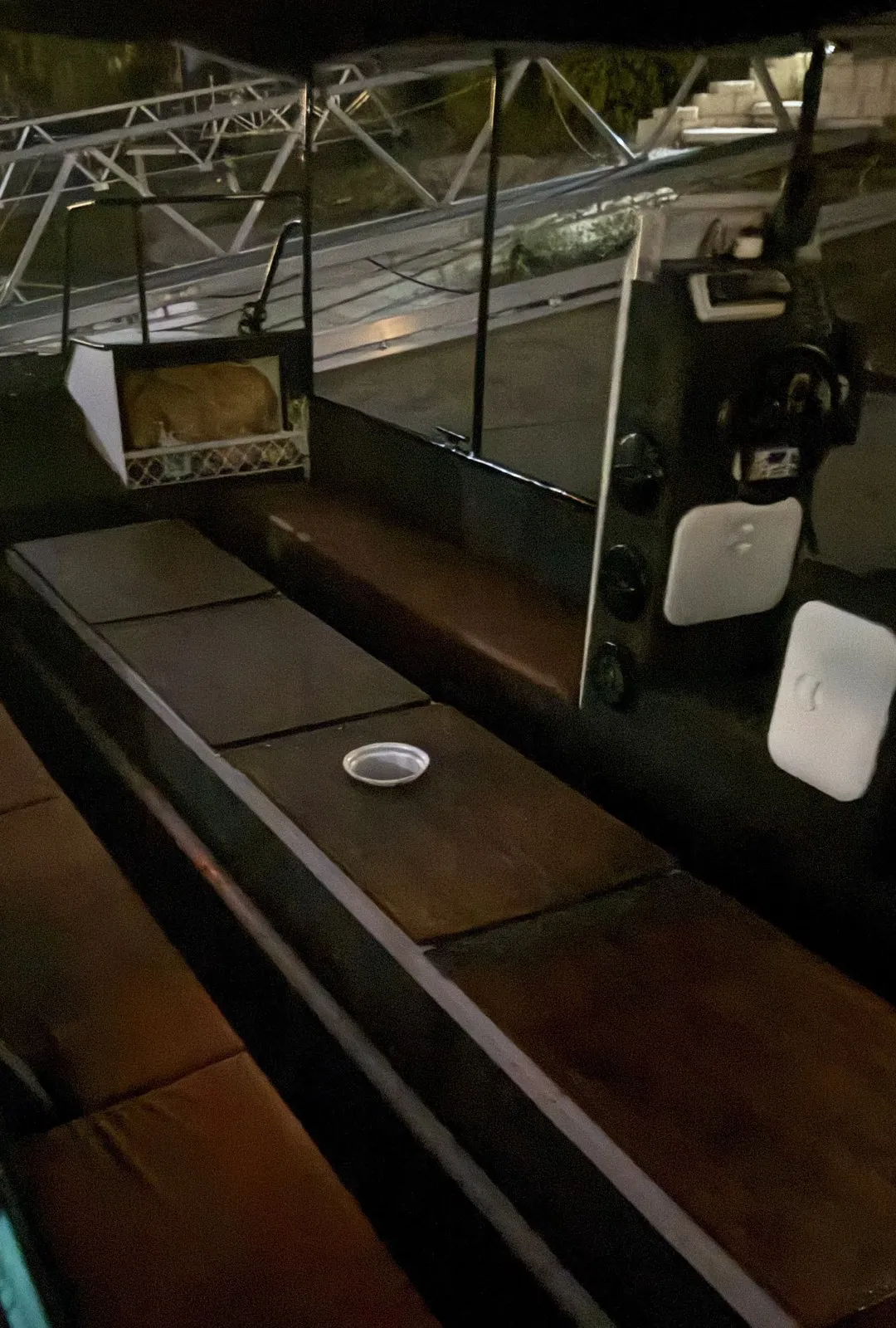 The deck of Coral Explorer at night with the lights on